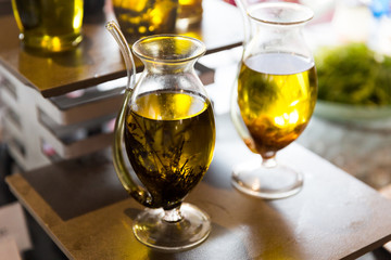 close up of glass jug with extra vergin olive oil