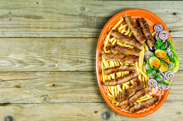 Rolled kabobs in bacon on an old wooden table