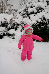 young girl playing in snow