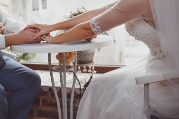 Beautiful young newlyweds embracing.