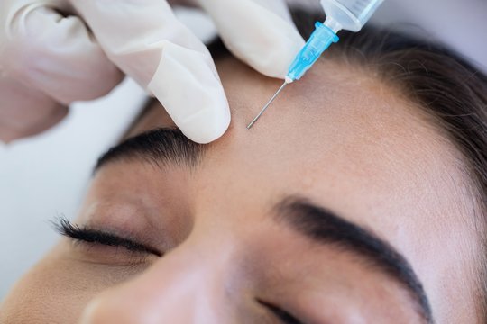 Woman receiving botox injection 