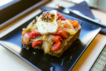 Healthy sandvich with fruits and nuts in a restaurant.
