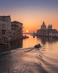 Water taxi at sunrise on Grand Canal in Venice