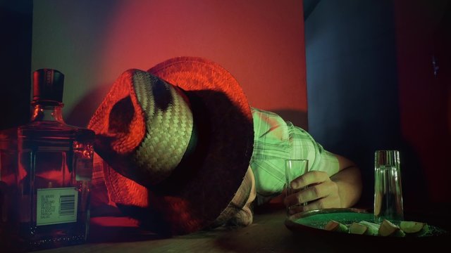 Caucasian man passed out for drinking  tequila shots alone in bar. 4k