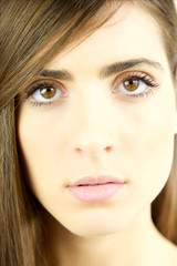Obraz premium Closeup portrait of young beautiful woman looking intense camera