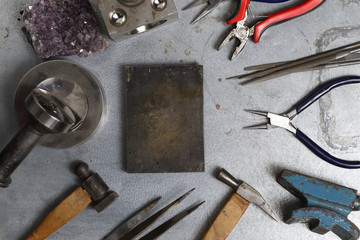 Fototapeta premium Tools set of jewellery. Jewelry workplace on metal background with copy space for text. Top view.