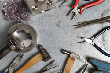 Tools set of jewellery. Jewelry workplace on metal background with copy space for text. Top view.