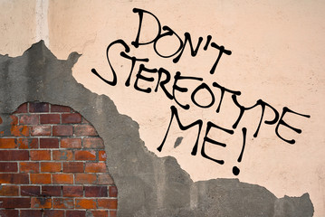 Handwritten graffiti Don't Stereotype Me! sprayed on the wall, anarchist aesthetics