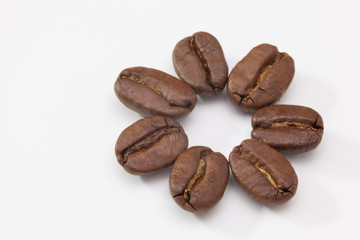 Coffee beans on the white table