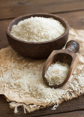 Pile of Basmati rice in a bowl with a spoon