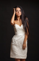 young beautiful caucasian brunette in gorgeous dress, motion shot