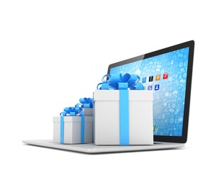 Gift box with ribbon bow on laptop keyboard. 3D rendering.