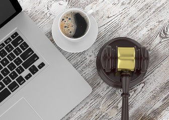 Gavel, laptop and coffee. 3D rendering.