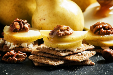 Appetizer from crispy dark breads, cottage cheese, walnuts and p