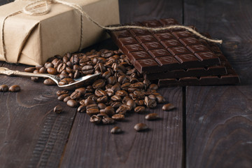 Tiles of dark chocolate and coffee beans