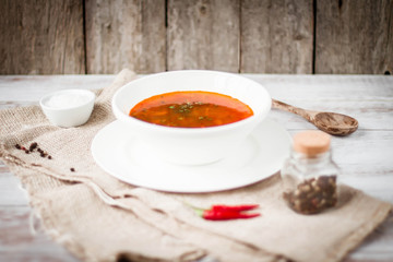 Soup on rustic wood background