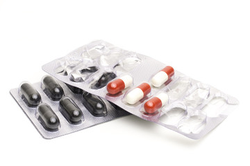 Capsules in blister pack on a white background
