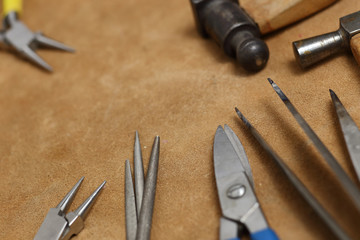 Tools of jewellery. Jewelry workplace on leather background with copy space for text. Top view.