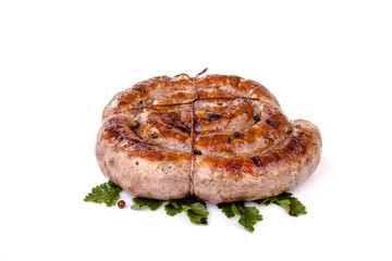 fried pork sausages on white background with cherry tomatoes and hot peppers