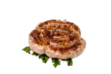 fried pork sausages on white background with cherry tomatoes and hot peppers