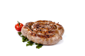 fried pork sausages on white background with cherry tomatoes and hot peppers