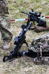 Military sniper aims at a target
