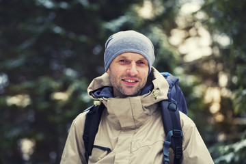 The man with the backpack.