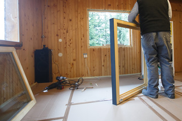 Worker installing new window