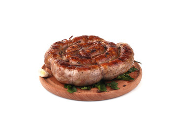 fried pork sausages on a barbecue on a wooden plate with cherry tomatoes and hot peppers