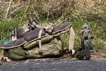 Military sniper aims at a target