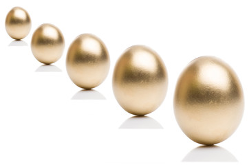 Golden eggs from  isolated on a white background. 