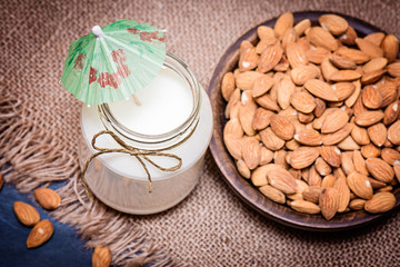 smoothie and almonds on a burlap