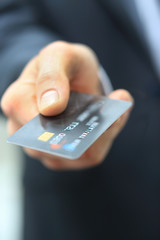 Close-up of credit card in human hand
