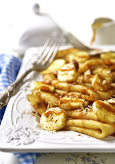 Pancakes with banana,caramel,nuts and cinnamon.