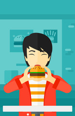 Man eating hamburger. 
