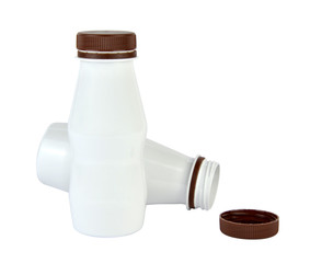 Opened and closed white plastic bottle with brown caps - isolated