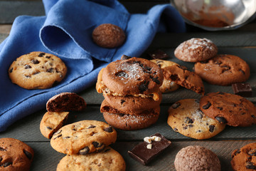 Fototapeta na wymiar Chocolate chip cookies beside napkin on wooden background