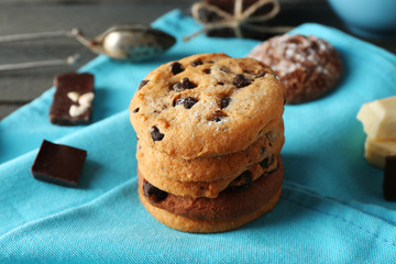 Chocolate chip cookies on blue napkin on wooden background
