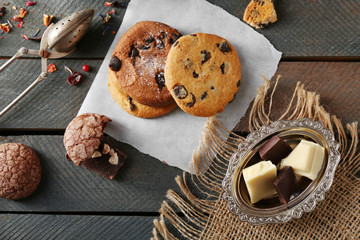 Chocolate chip cookies on napkin on wooden background