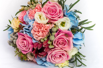 Colorful bouquet of the bride and burning candles