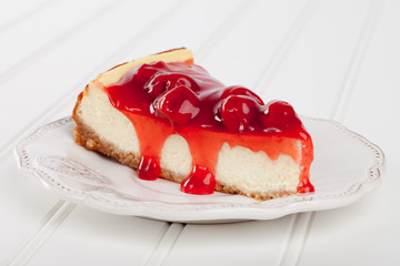 Homemade cherry cheesecake top view on white