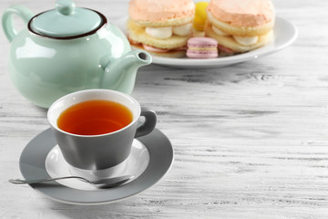 Cup of tea with delicious cakes