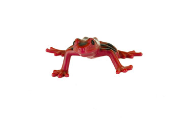 Red frog toy on white background / Green rubber frog toy - bath toy - white background isolated / Platoon green toy frogs. Close up view / Toy frog