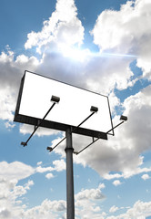 Empty billboard in front of beautiful cloudy sky