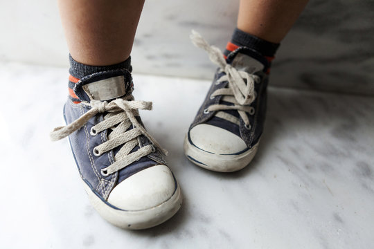 Close-up of boy wearing sneakers