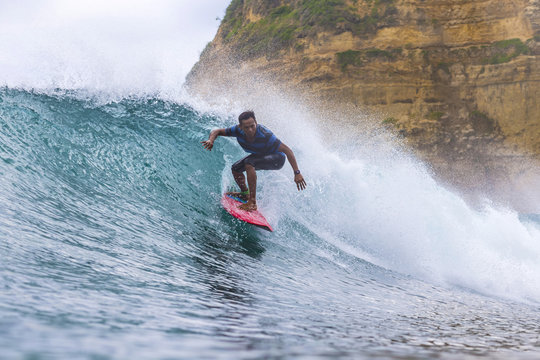 Indonesia, Lombok, Surfer on a wave