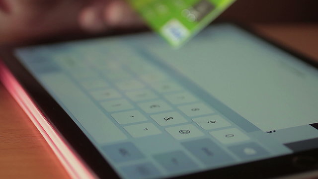 woman making shopping online with a credit card and tablet computer: eBay, amazon
