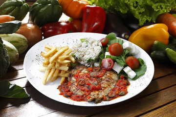 Grilled meat with trimmings