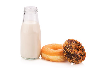 Milk bottle and donut on white background