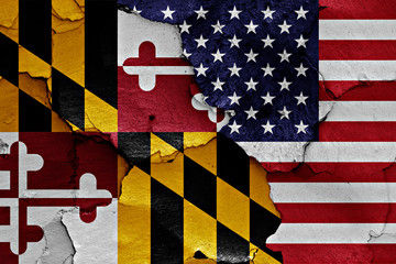 Obraz premium flags of Maryland and USA painted on cracked wall